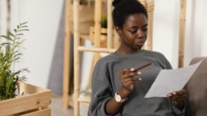 Woman entrepreneur in Africa using Tiers app to save in USD and avoid local currency inflation.