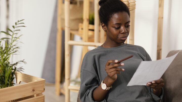 Woman entrepreneur in Africa using Tiers app to save in USD and avoid local currency inflation.